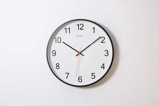 How a Feature Wall Clock Fixes a Blank Living Room Wall Without Overdecorating