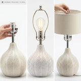 Signature Design by Ashley Rainermen Casual Ceramic Table Lamp, Transparent White Glaze Finish, Drum Hardback Fabric Shade, 11" W x 11" D x 21" H, Off White