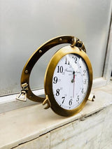 Franklin Murphy's Analog Beautiful Nautical Porthole Wall Clock, Antique Brass Finish, 12" Aluminum with Glass Face, Maritime Decor, Battery Operated Home Decor