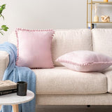 PAVILIA Light Pink Throw Pillow Covers with Pom Pom 18x18 Set of 2, Decorative Pillow Cases for Bedroom Aesthetic, Small Throw Pillows Set for Bed, Velvet Euro Plush Cushion Covers for Sofa Couch